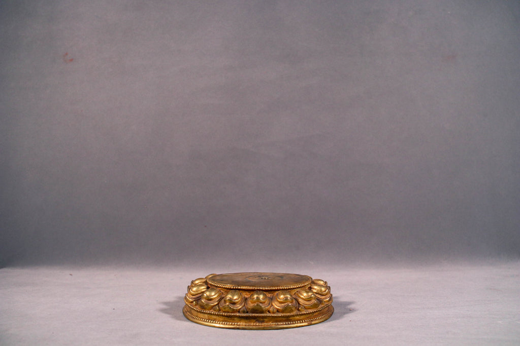 Solid copper lotus base supporting dynamic dancing pose of Ekajati statue.