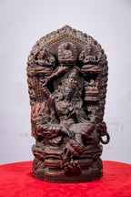 Handcrafted wooden shrine featuring Manjushri seated on a lion.